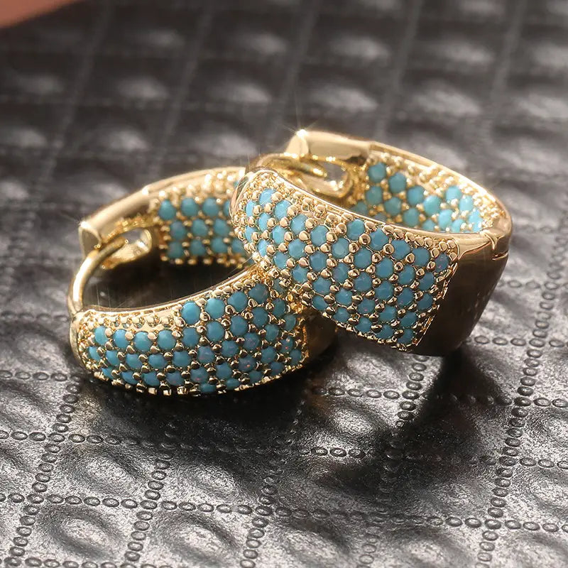 Orecchini a cerchio con perline turchesi color oro | Oro