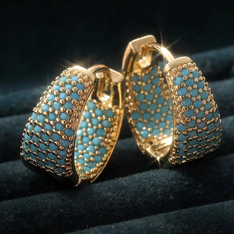 Orecchini a cerchio con perline turchesi color oro | Oro